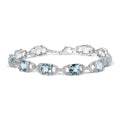 .925 Sterling Silver 7x7 mm Cushion Cut Blue Topaz and 1/20 cttw Round Cut Diamond Fashion Tennis Bracelet (I-J Color, I1-I2