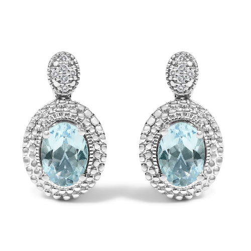 Pendientes con acento de diamante de plata de ley .925 y topacio azul ovalado con halo de cuentas (color I-J, claridad I1-I2)