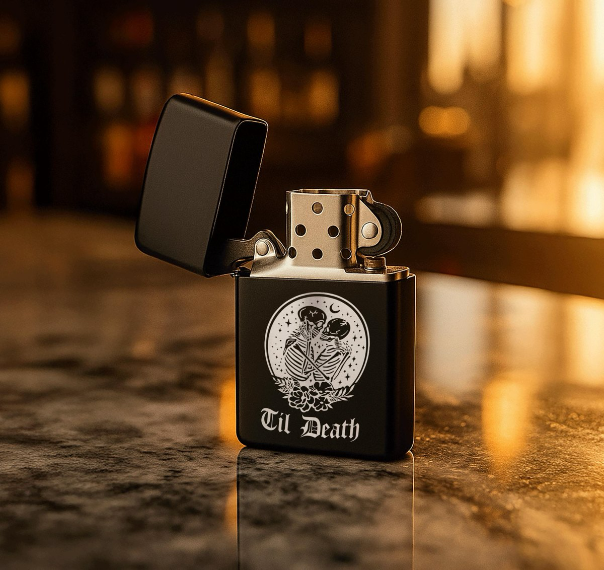 Matte black lighter presented in a black tin