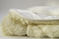 Sleep & Beyond myDual Reversible Mattress Pad. Supplier construction close-up, not a full-size crib product photograph. Size and included pieces are defined by the selected SKU.